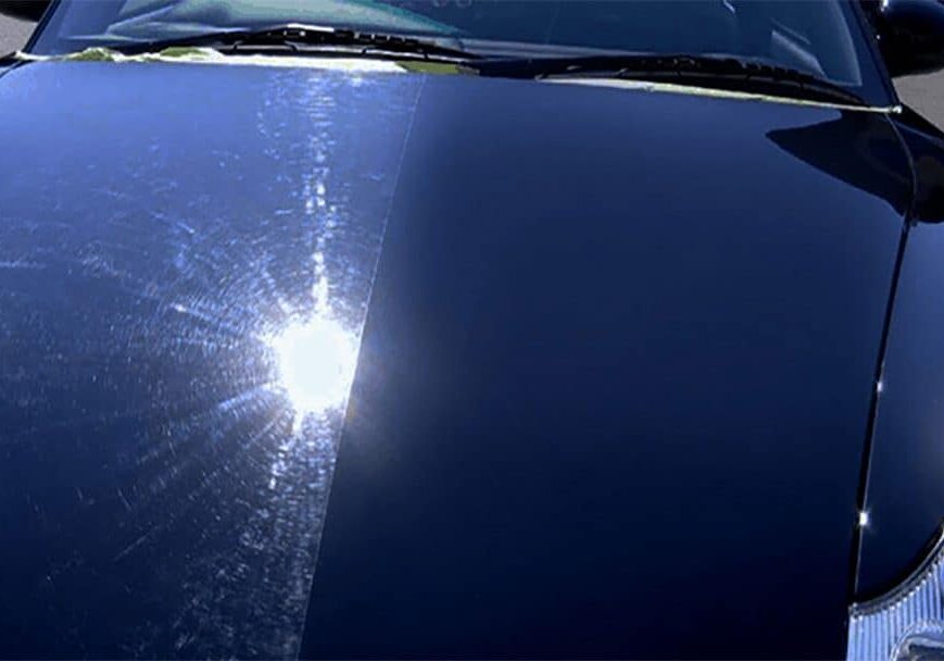 A sun shining through the windshield of a car.