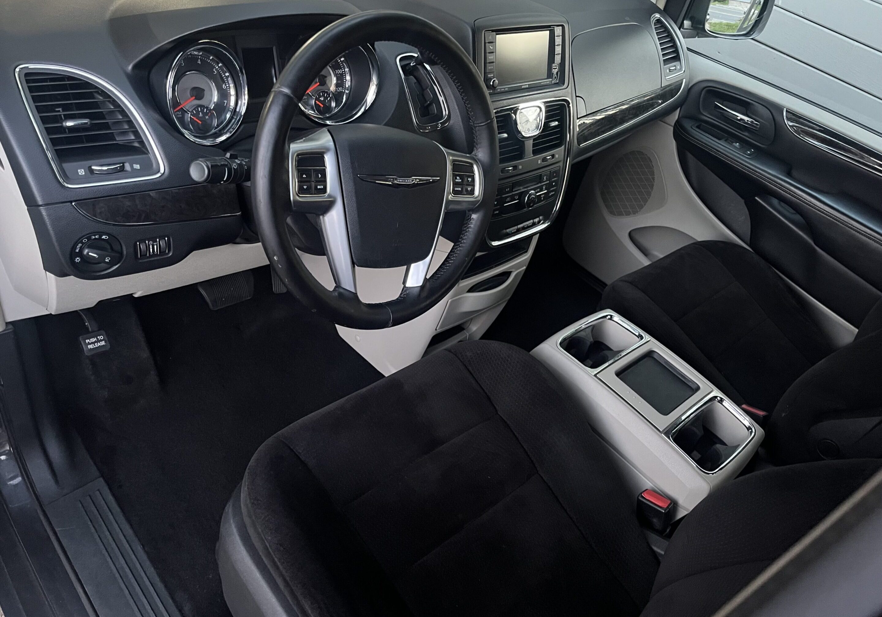 A car with black and white interior in the middle of it.